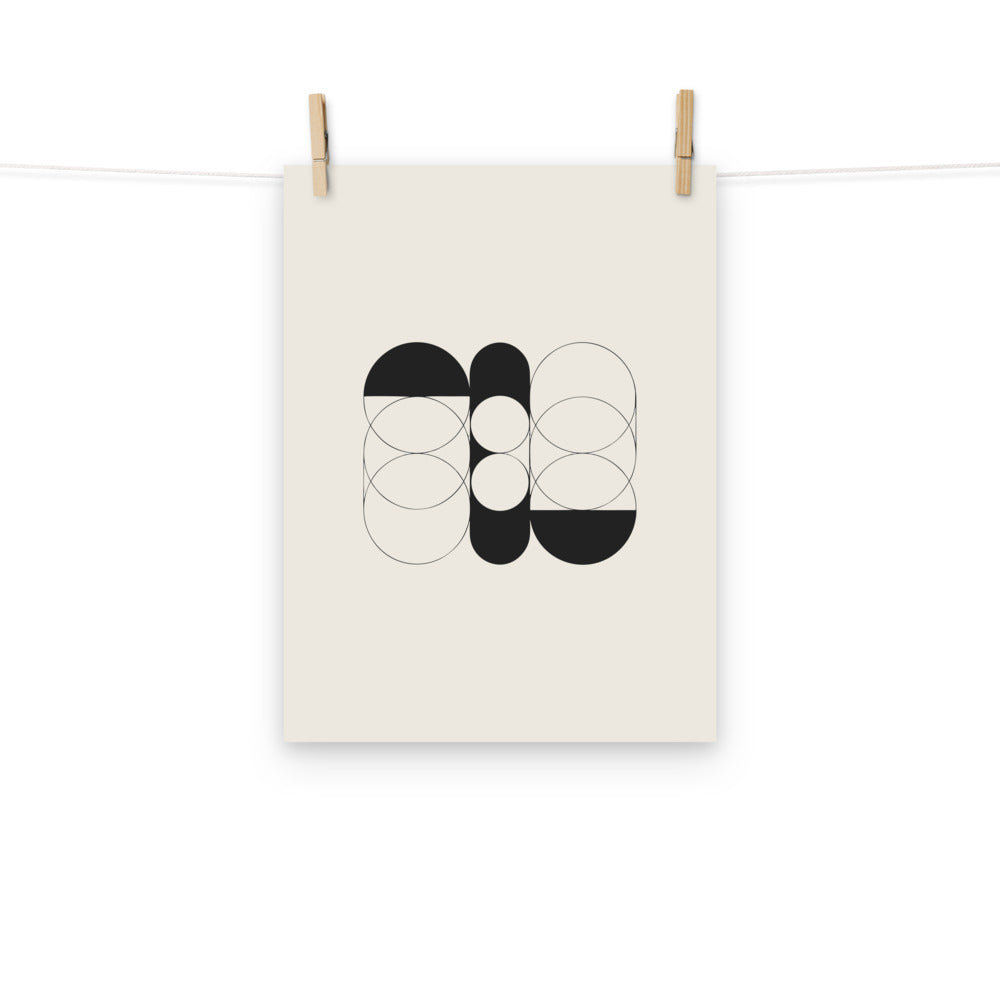 A sequence of nested Cassini ovals in fine hairline weight, transitioning from two loops to a flattened ellipse on an art print. Hung with wooden pegs, 12″×16″ size.