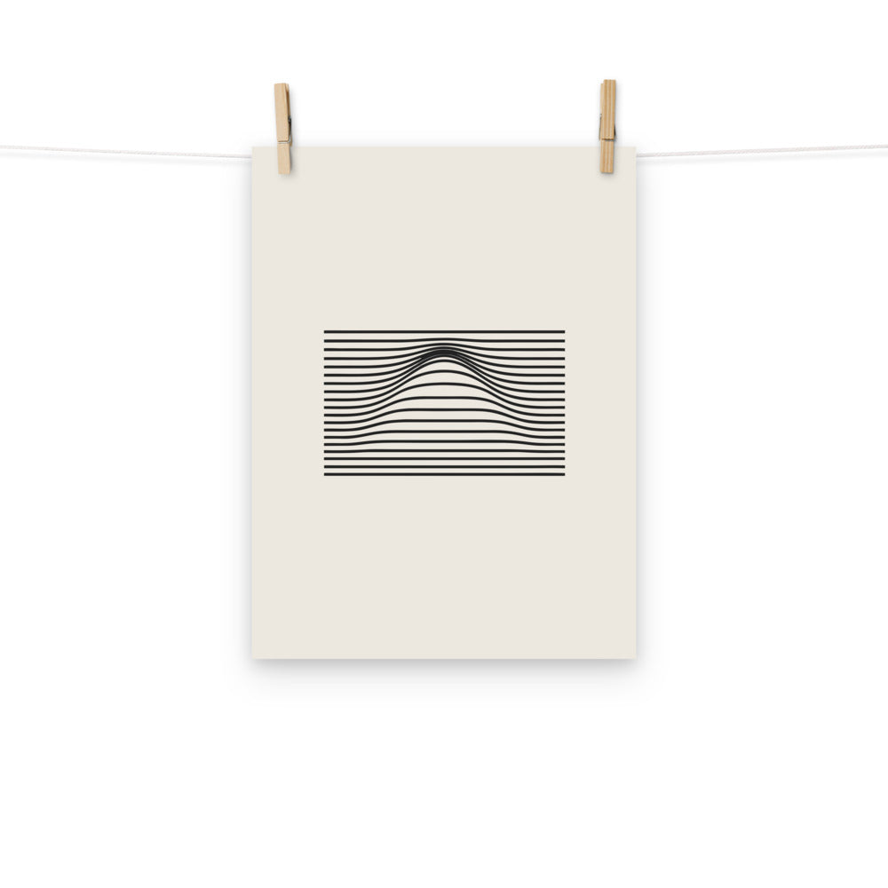 A geometric graphic of parallel horizontal lines bending upward in the center to form a Gaussian bell curve on an art print. Hung with wooden pegs, 12″×16″ size.