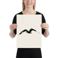 A single M-shaped sumi-e brush stroke representing a gliding gull, printed on a fine art print. 12″×16″ size.