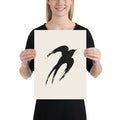 A minimalist sumi-e ink painting of an ascending swallow printed on an art print. 12″×16″ size.