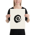 A minimal sumi-e spiral representing a coiled snail shell printed on an art print. 12″×16″ size.