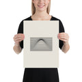 A geometric graphic of parallel horizontal lines bending upward in the center to form a Gaussian bell curve on an art print. 12″×16″ size.