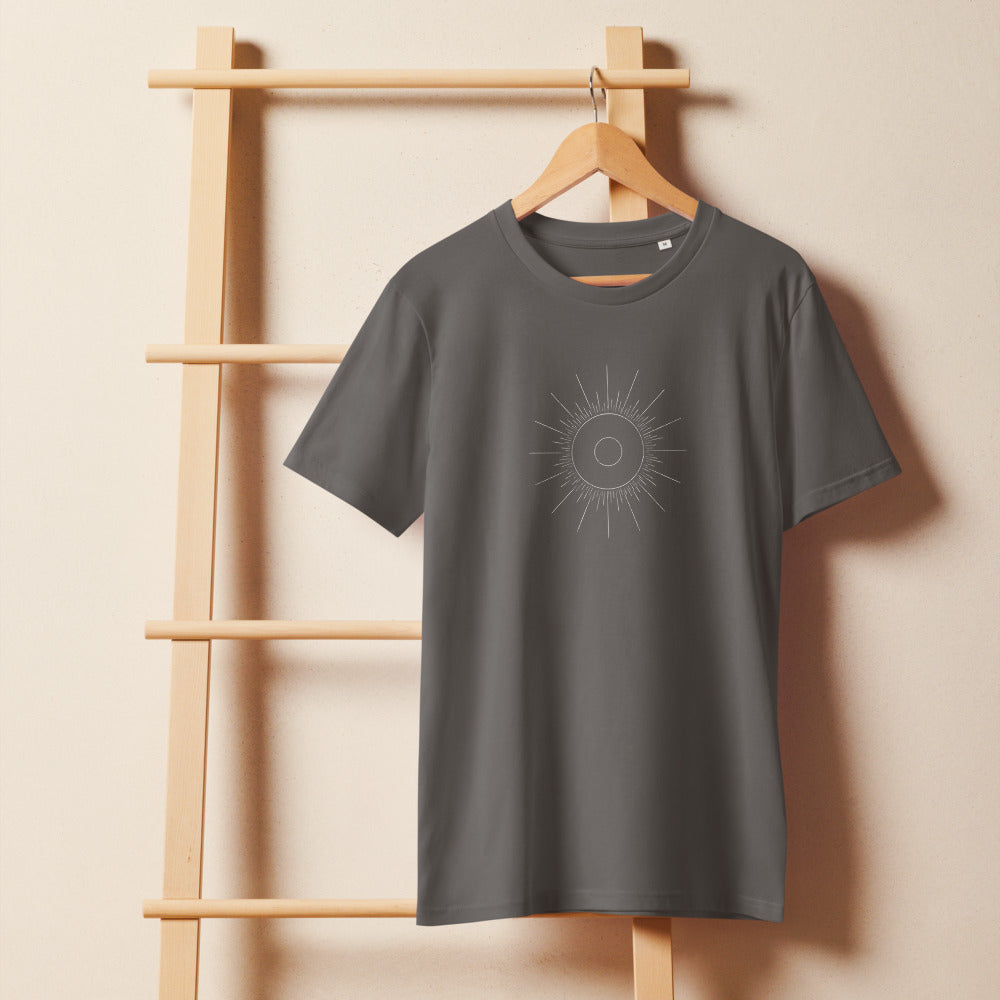 An annular solar eclipse celestial geometry diagram with concentric circles and fine ray lines on a t-shirt. On a wooden hanger, Slate colourway.