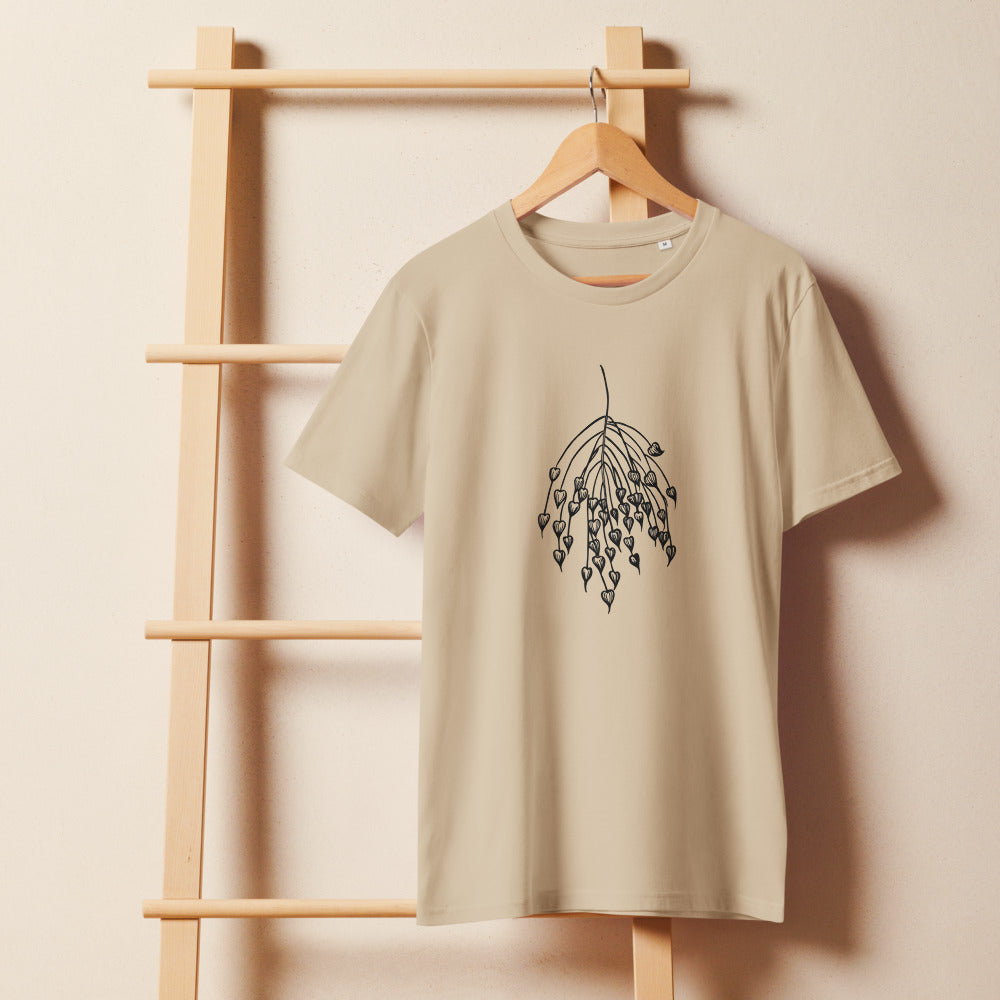 A minimalist botanical line art design of a quaking grass panicle with heart-shaped spikelets printed on a t-shirt. On a wooden hanger, Clay colourway.