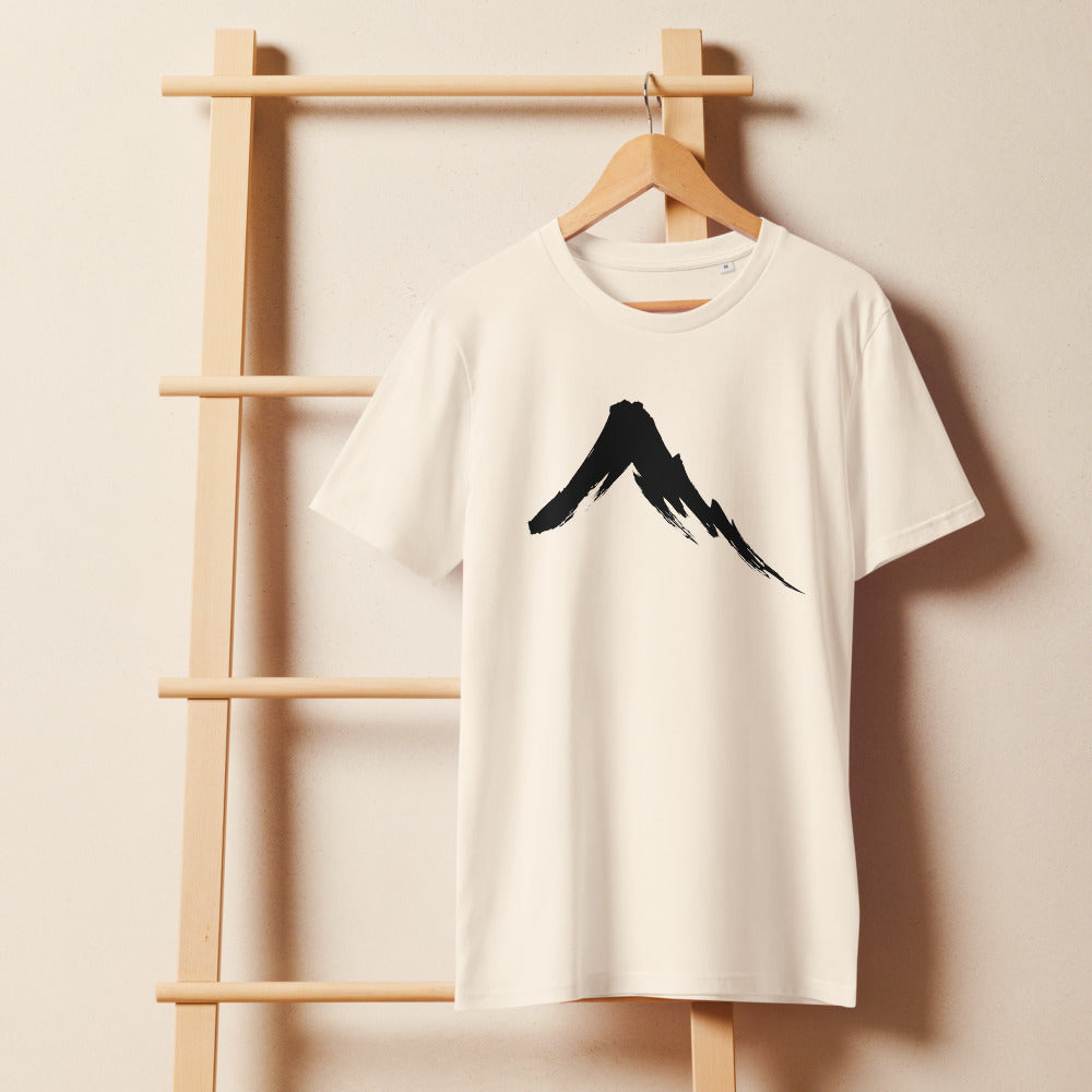 A single downward sumi-e ink brush stroke depicting a steep volcanic mountain slope on a t-shirt. On a wooden hanger, Bone colourway.