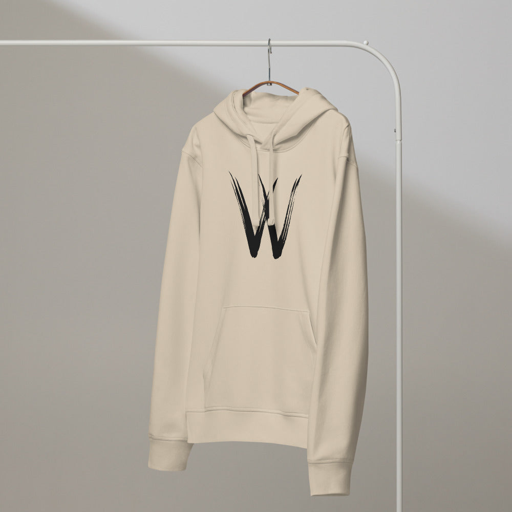 A minimalist sumi-e brush stroke design of the capital letter W printed on a hoodie. On a hanger, Clay colourway.