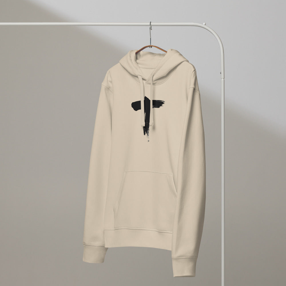 Black ink brushstroke art of the letter T printed on a comfortable hoodie. On a hanger, Clay colourway.