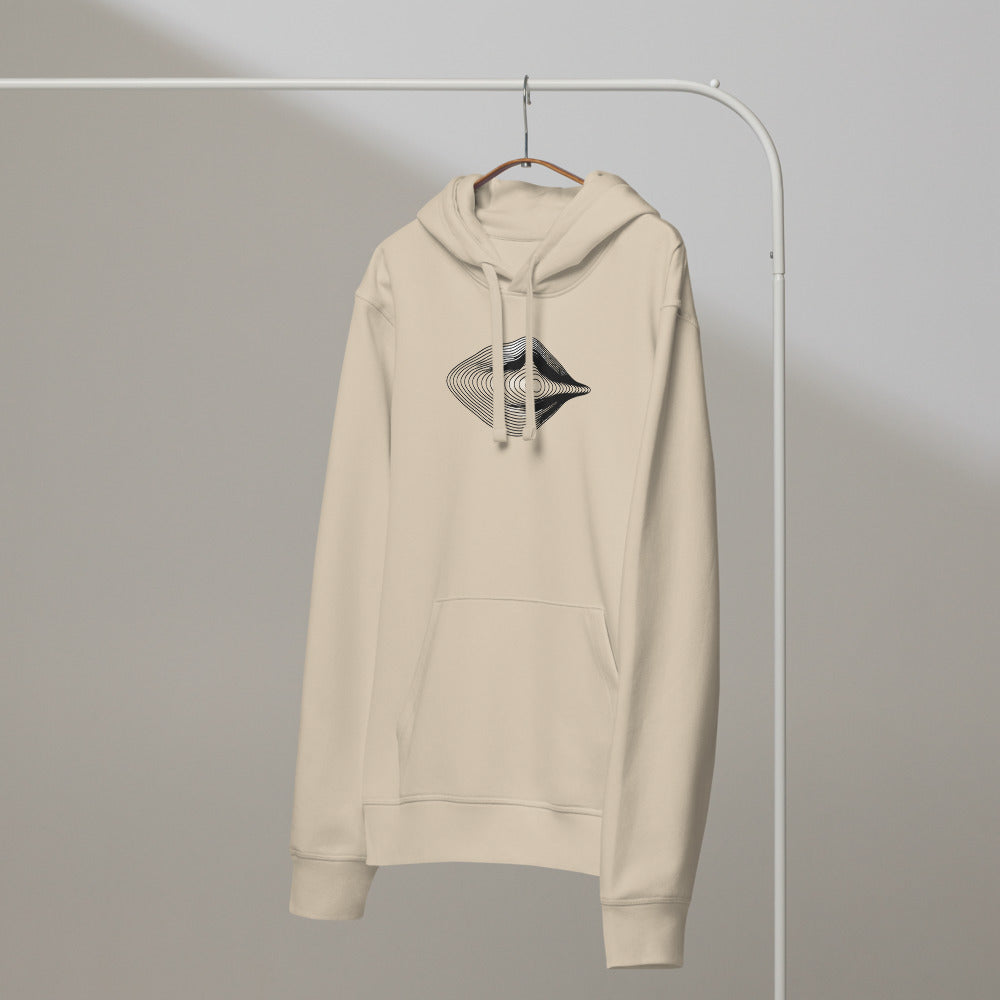 An engraving-style topographic contour design forming an asymmetric eye printed on a hoodie. On a hanger, Clay colourway.