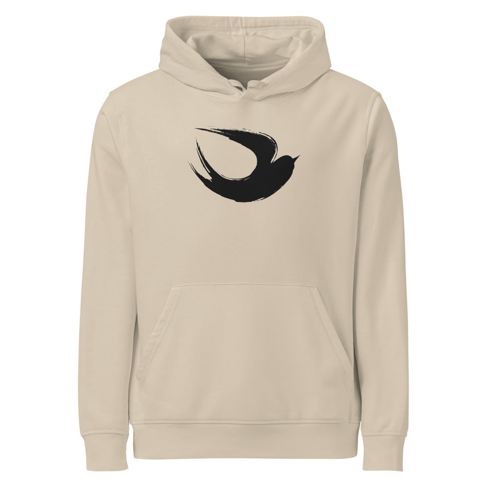 A minimalist sumi-e ink brush painting of a flying swallow on a hoodie. Shown on the Clay (Desert Dust) colorway.