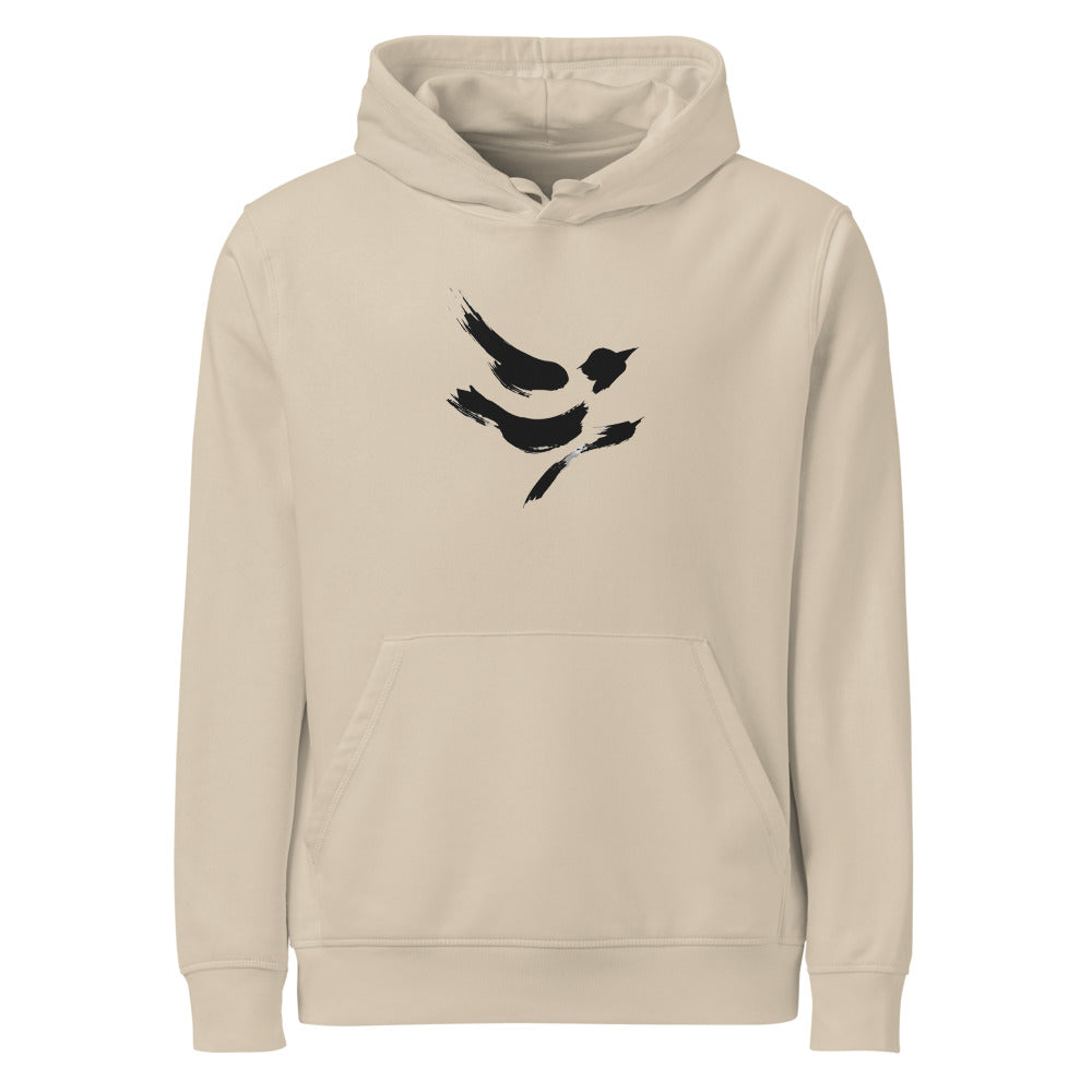A minimal sumi-e design of a diving sparrow in three quick ink strokes on a hoodie. Shown on the Clay (Desert Dust) colorway.