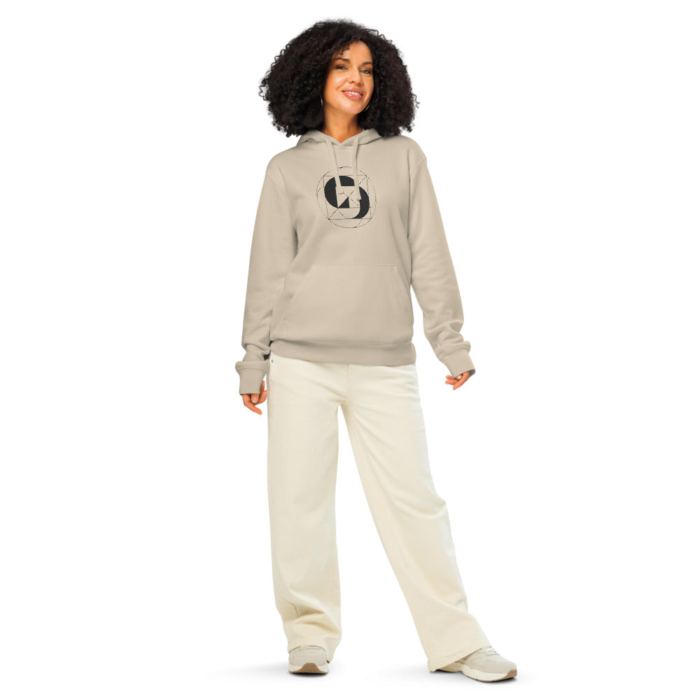 A geometric design of inverted concentric circles in thin vector lines on a hoodie. Worn by a woman, Clay colourway.