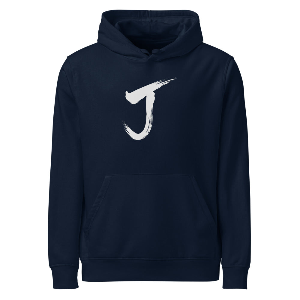 The letter J rendered in a single black sumi-e brush gesture, printed on a hoodie. Shown on the Ink (French Navy) colorway.