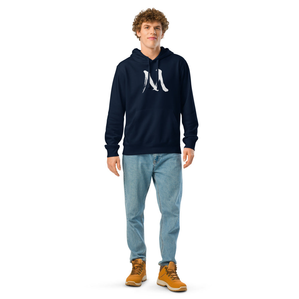 The letter M in black sumi-e brush stroke style printed on a minimalist hoodie. Worn by a man, Ink colourway.