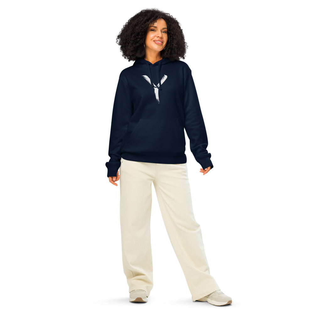 A minimalist sumi-e brush gesture of the capital letter Y printed on a classic pullover hoodie. Worn by a woman, Ink colourway.